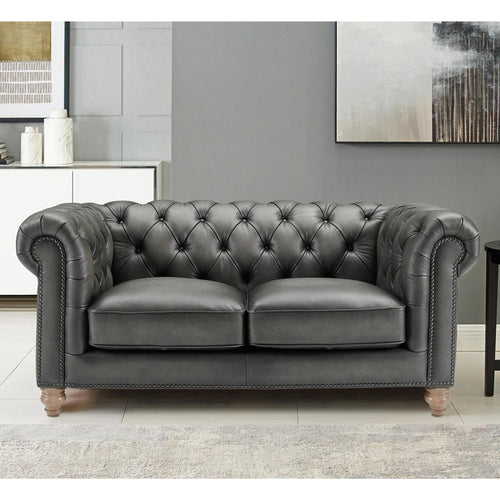 Grey Chesterfield sofa.